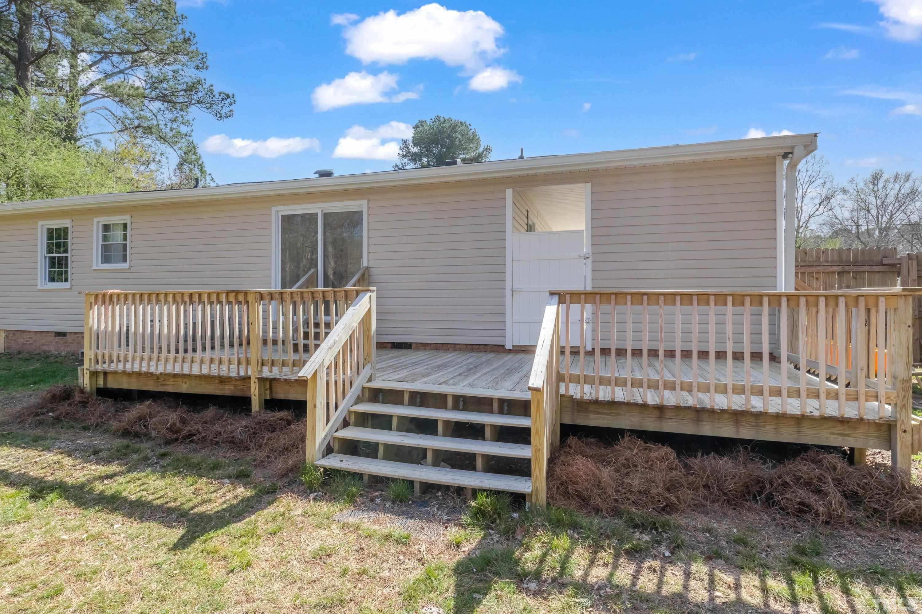 5809 Neuse Street Raleigh, NC 27610 - Photo 18 of 19 a view of a house with a yard