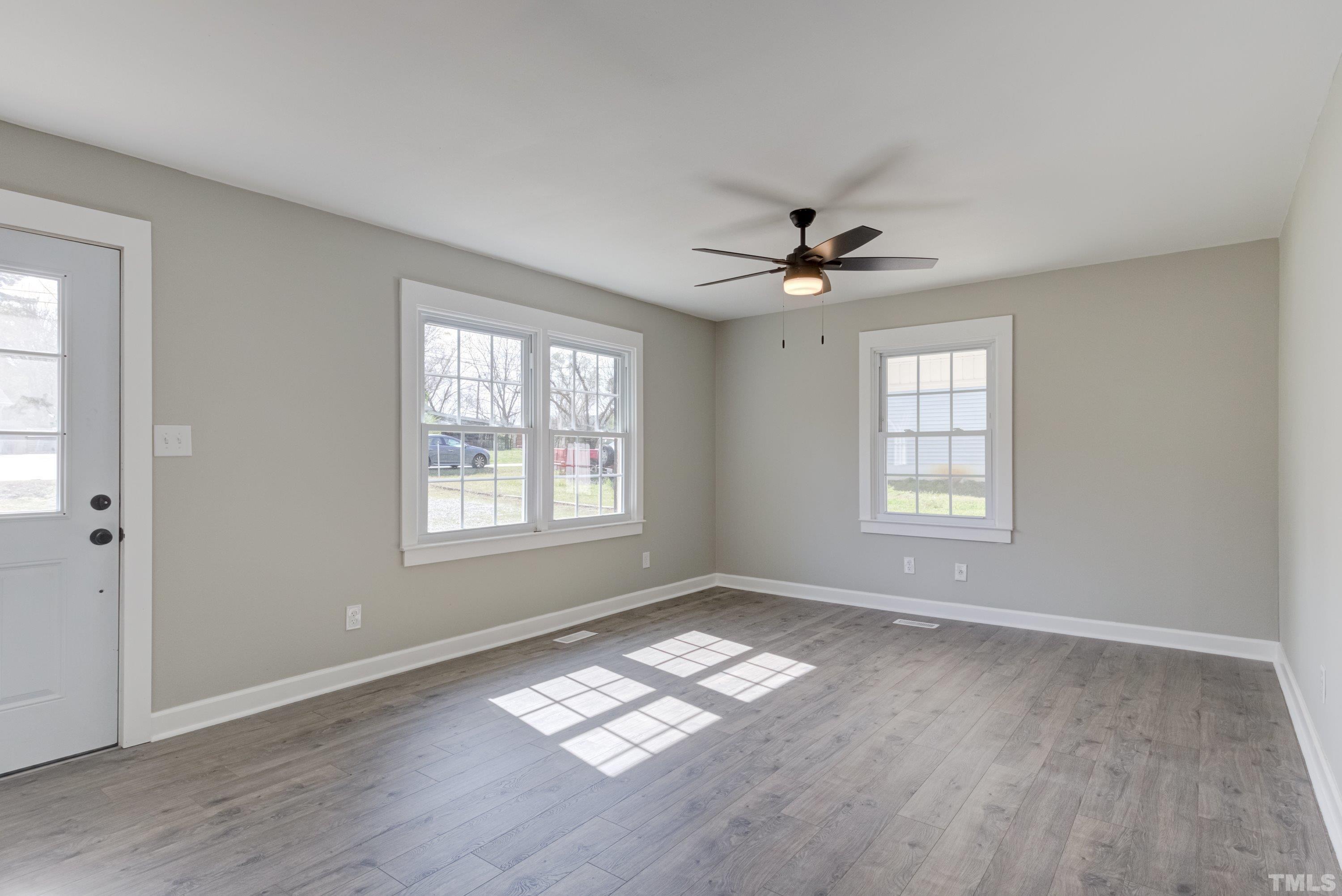 5809 Neuse Street Raleigh, NC 27610 - Photo 9 of 19 a view of an empty room with a window