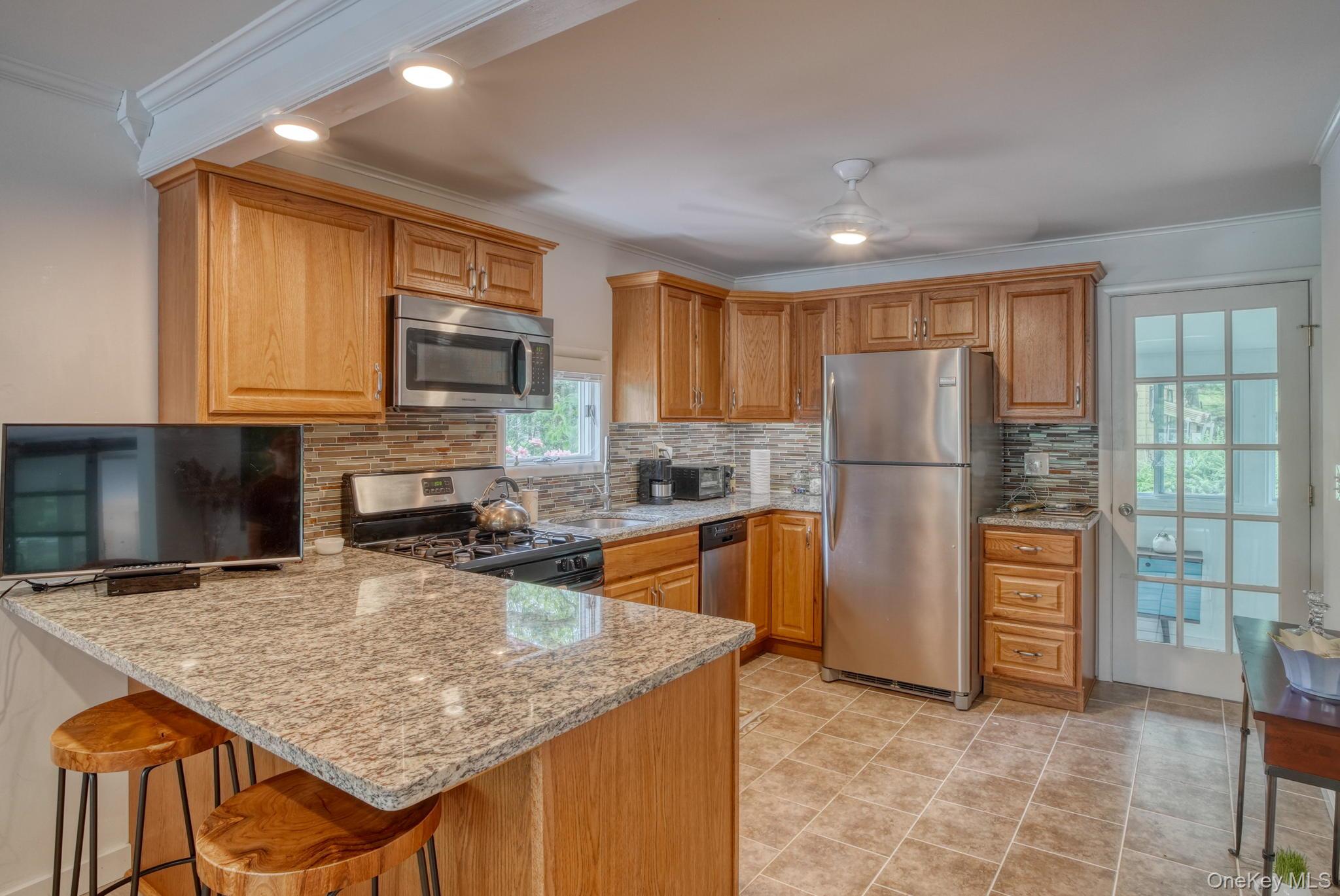 2 Bodine Lake Road Yulan, NY 12792 - Photo 13 of 32 a kitchen with refrigerator cabinets and wooden floor