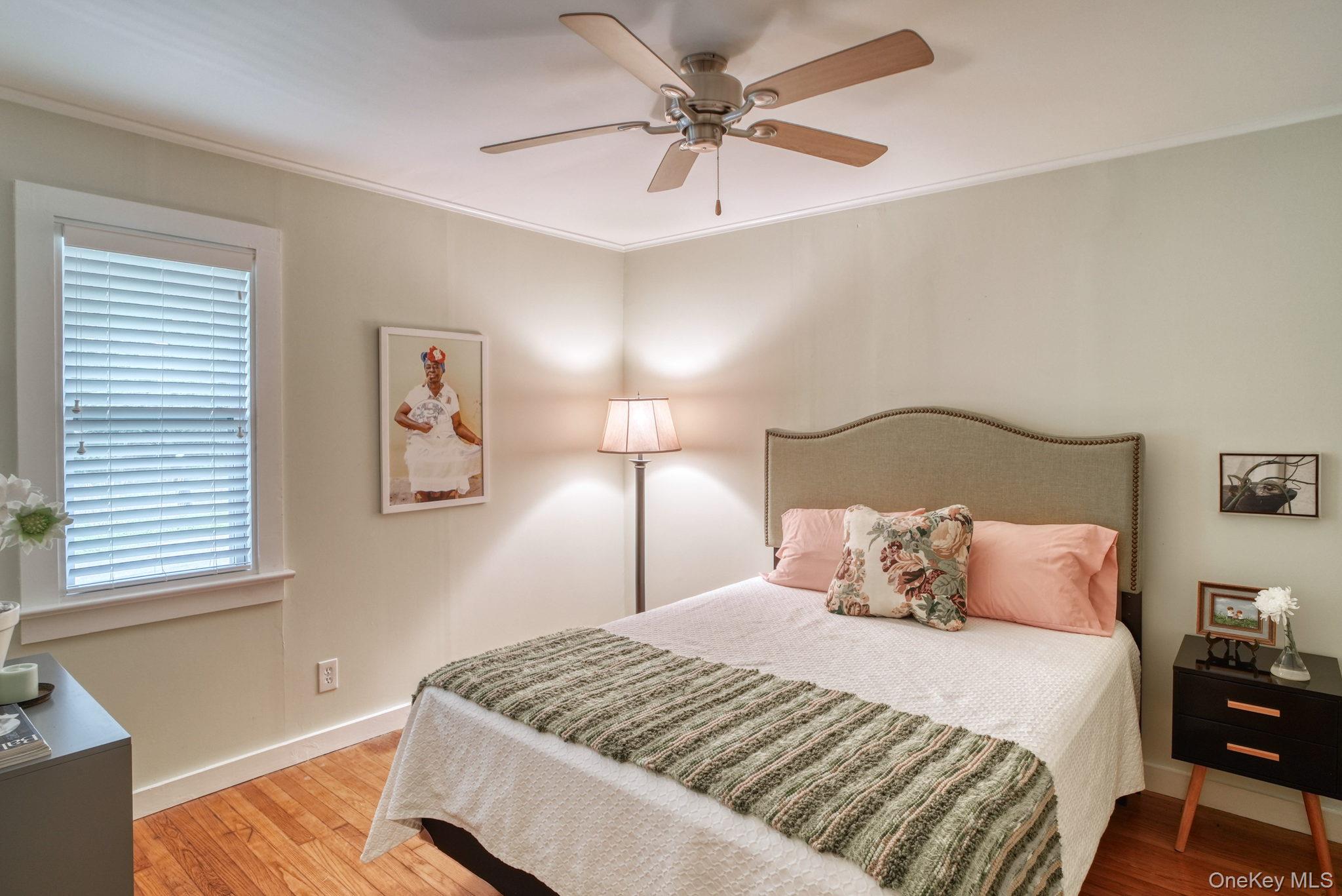 2 Bodine Lake Road Yulan, NY 12792 - Photo 19 of 32 a bedroom with a bed and a chandelier