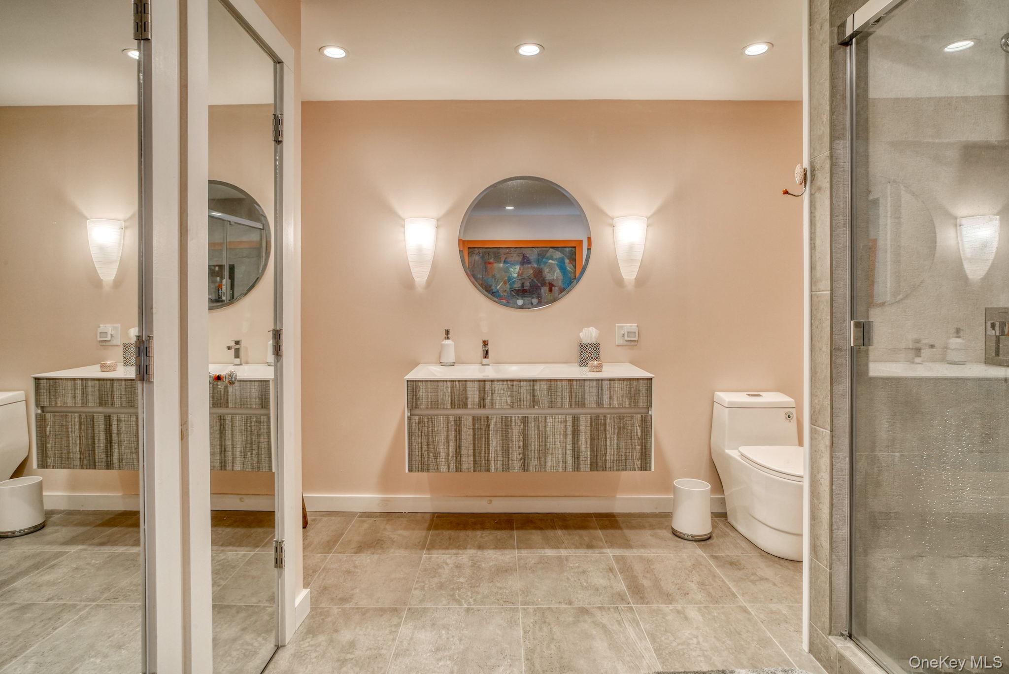 2 Bodine Lake Road Yulan, NY 12792 - Photo 19 of 32 a bathroom with a toilet a sink and mirror