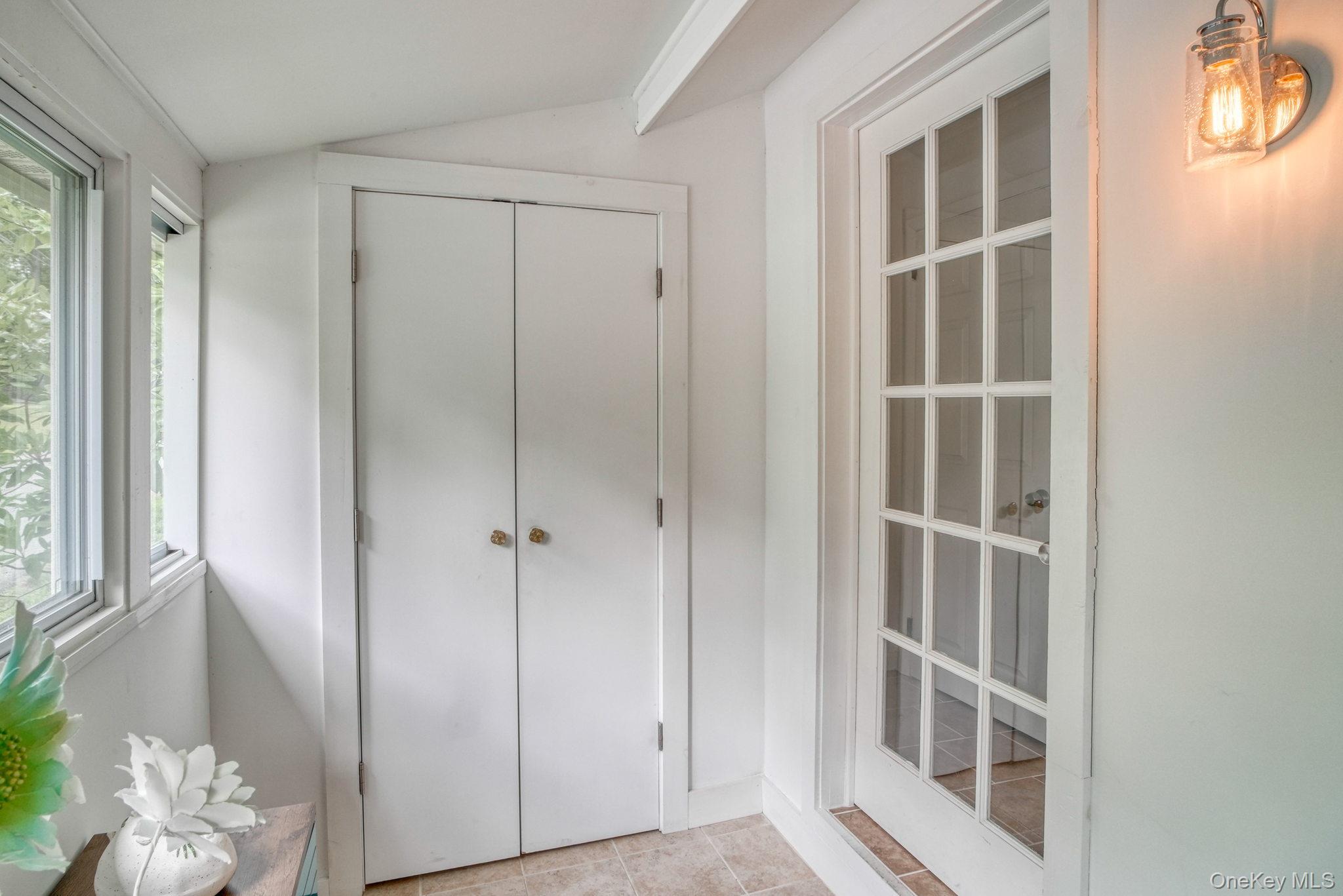 2 Bodine Lake Road Yulan, NY 12792 - Photo 23 of 32 a view of a hallway with windows and entryway