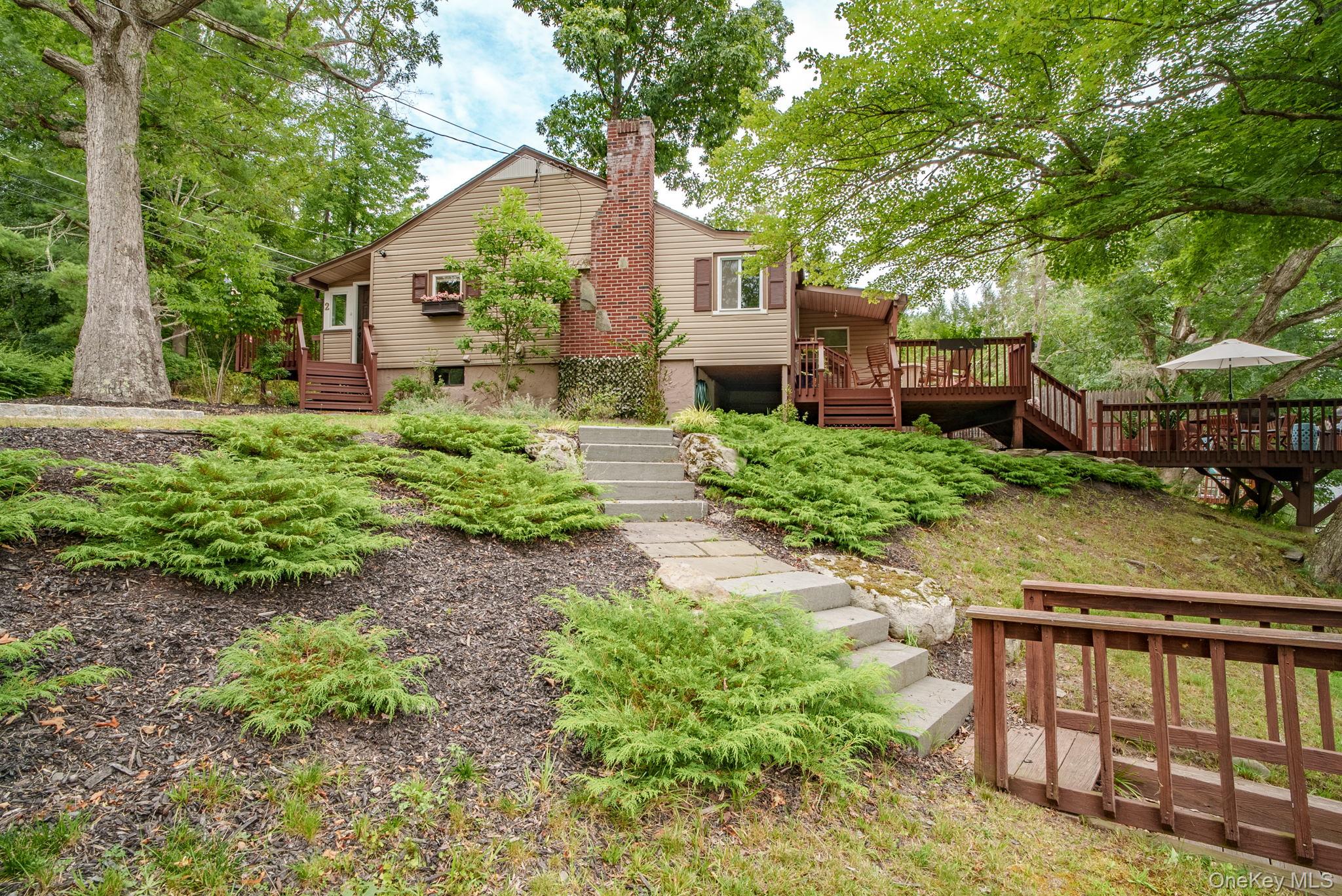 2 Bodine Lake Road Yulan, NY 12792 - Photo 6 of 32 a view of a house with a yard and furniture