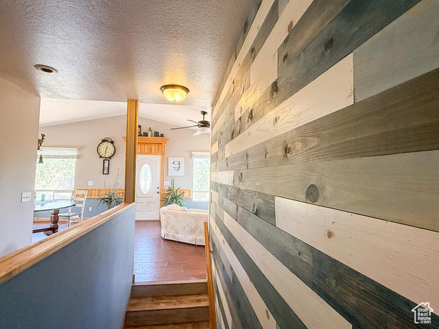 425 East Mule Deer Road Central, UT 84722 - Photo 11 of 72 Hallway with lofted ceiling, dark wood-type flooring, and a textured ceiling