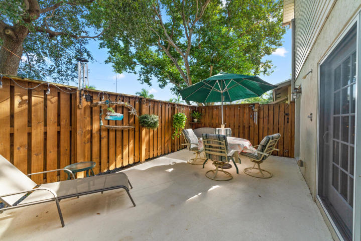 2016 Joy-Rene Lane, Unit 2 North Palm Beach, FL 33408 - Photo 13 of 13 a view of chair and table in the patio
