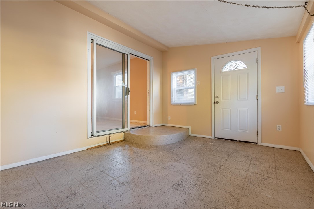 337 Yager Road Clinton, OH 44216 - Photo 33 of 34 Entryway/ 4-season room with light tile floors