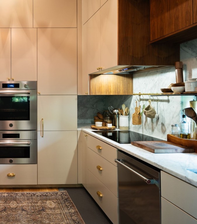 1001 Madrone Road West Lake Hills, TX 78746 - Photo 17 of 40 a kitchen with stainless steel appliances kitchen island granite countertop a sink a stove and cabinets