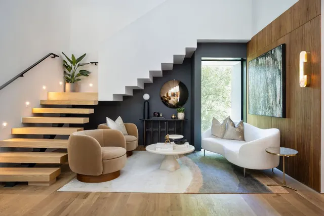 a living room with furniture and a painting