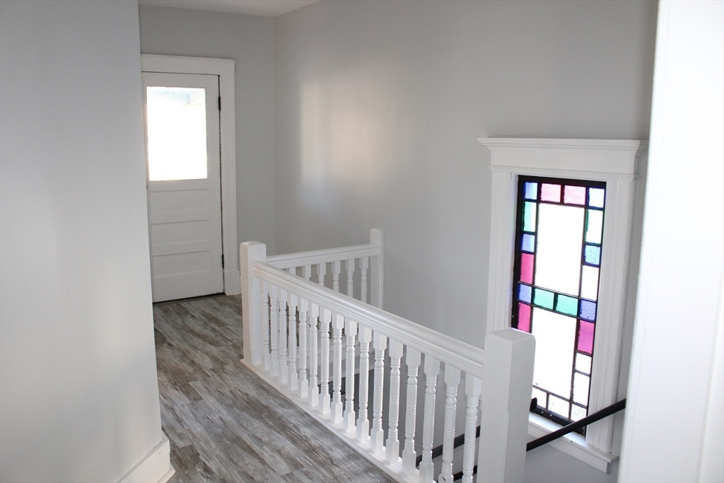 25 Malden Street Springfield, MA 01108 - Photo 21 of 25 a view of a hallway with wooden floor and entryway