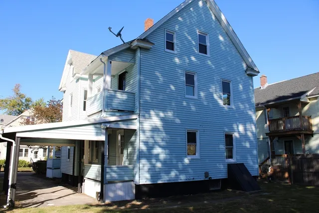 a front view of a house with barbeque
