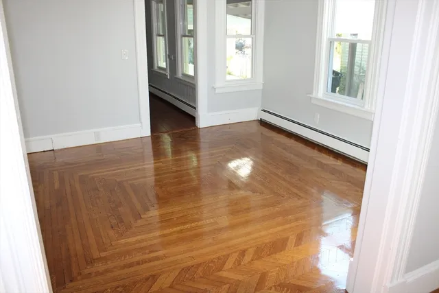 a view of an empty room with windows