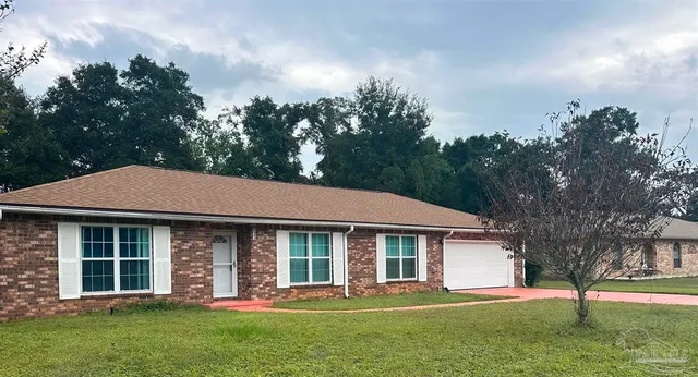 front view of a house with a yard