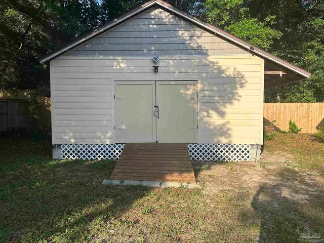 a view of a yard with a bench