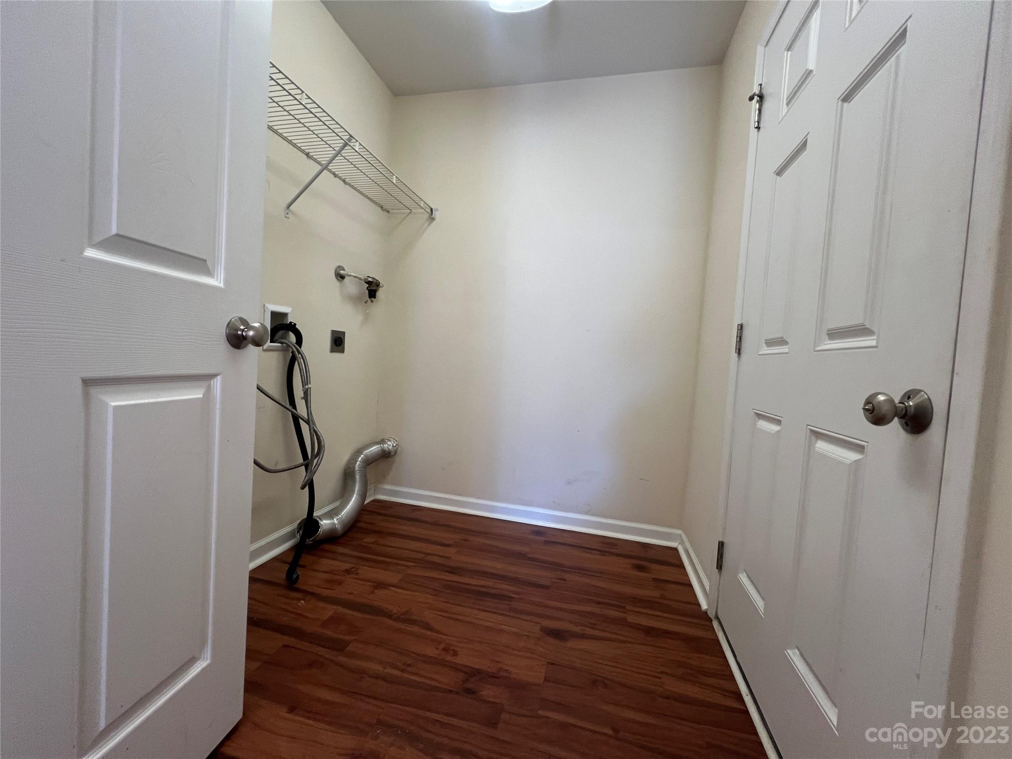 3835 Lee Moore Road Maiden, NC 28650 - Photo 9 of 16 a view of a hallway with wooden floor and staircase