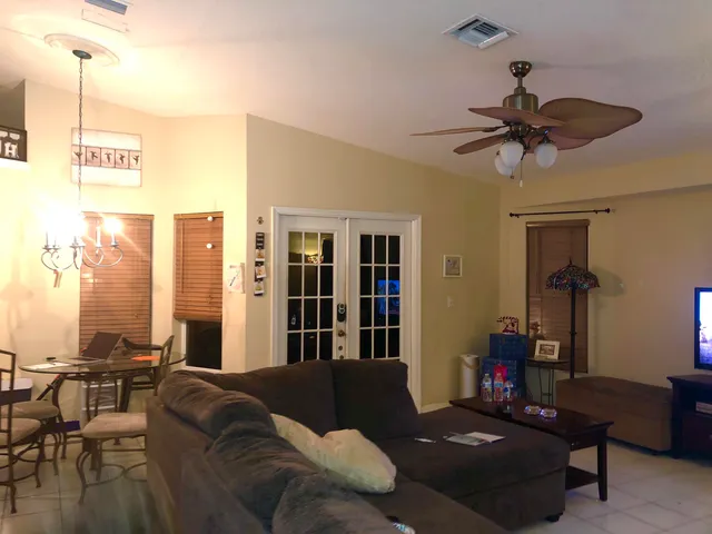 a living room with furniture and a window