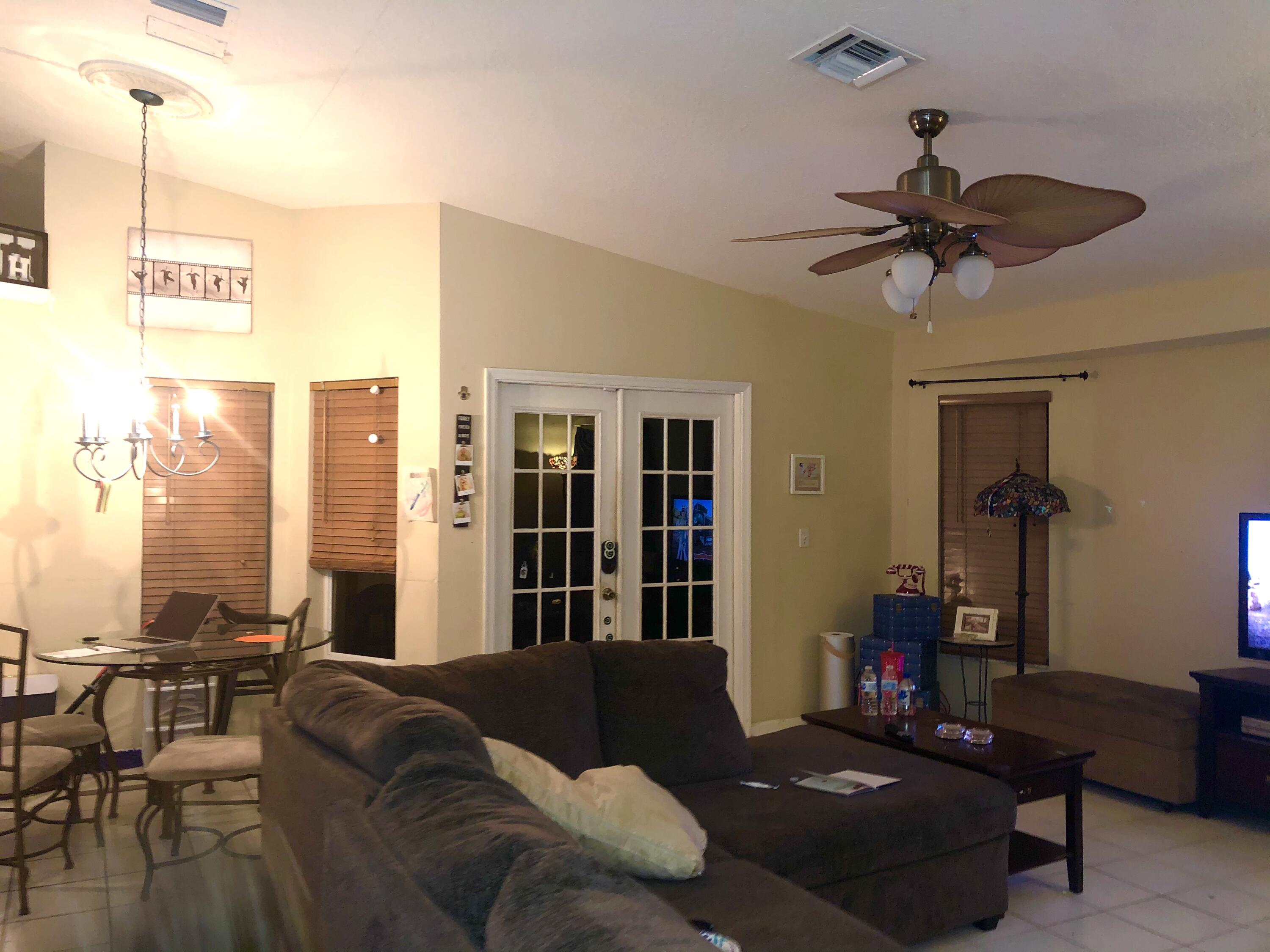 12136 88th Place North West Palm Beach, FL 33412 - Photo 13 of 29 a living room with furniture and a window
