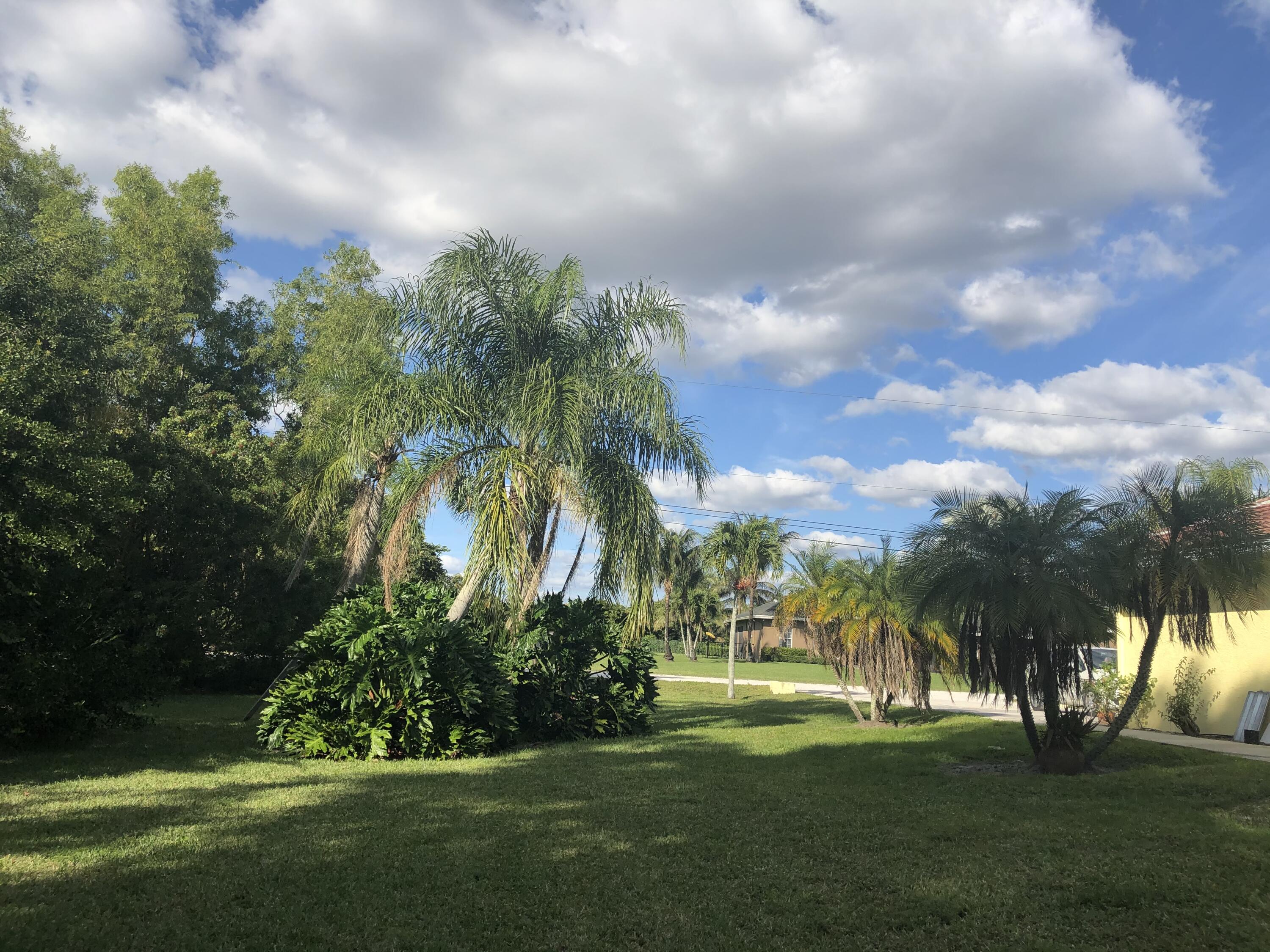 12136 88th Place North West Palm Beach, FL 33412 - Photo 15 of 29 a view of a golf course with a garden
