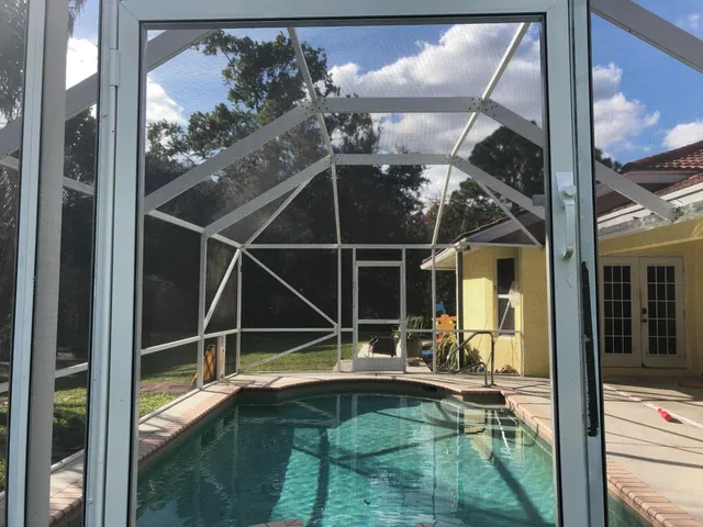 a view of a balcony with dining area