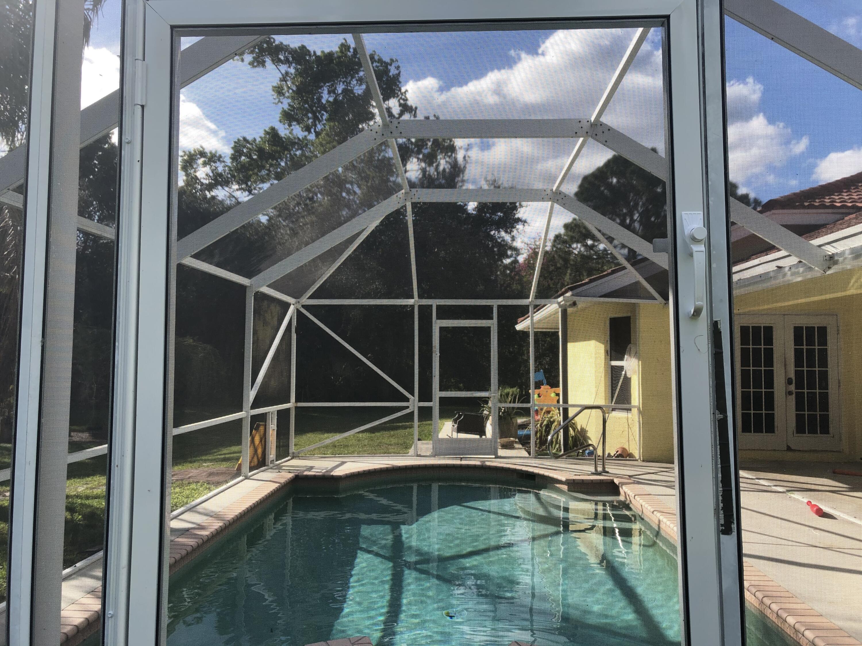 12136 88th Place North West Palm Beach, FL 33412 - Photo 2 of 29 a view of a balcony with dining area