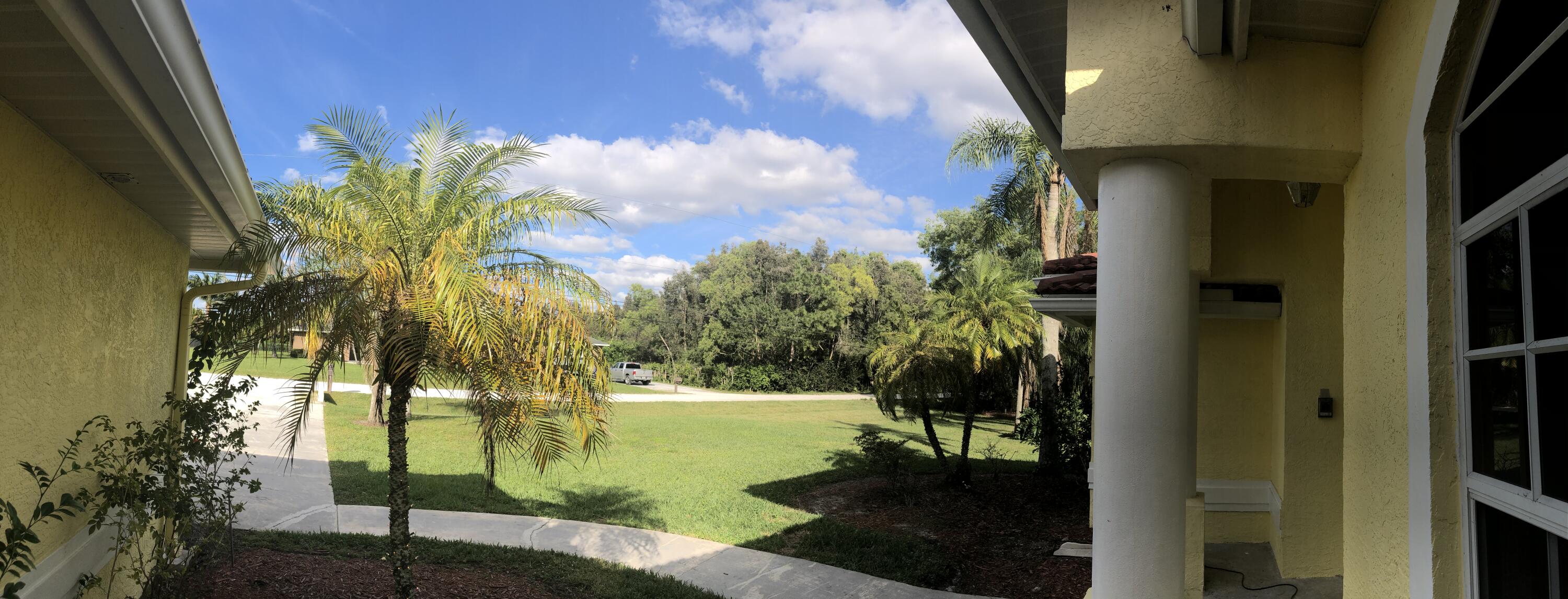 12136 88th Place North West Palm Beach, FL 33412 - Photo 25 of 29 a view of a garden