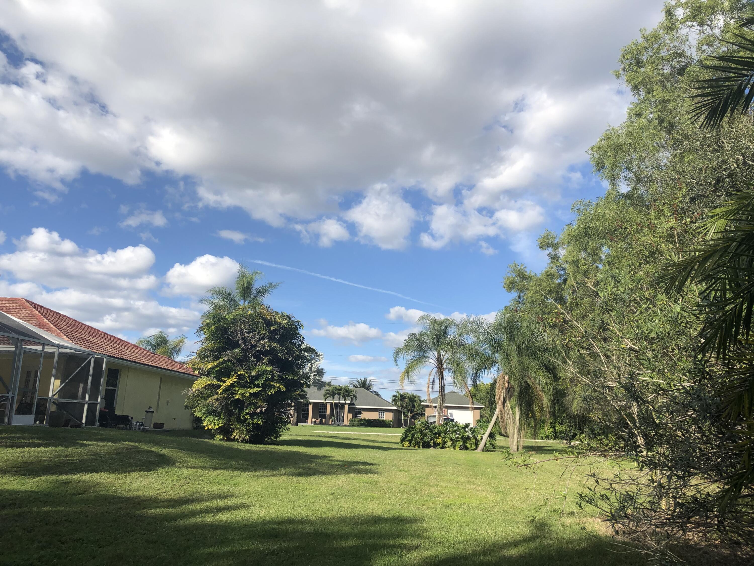 12136 88th Place North West Palm Beach, FL 33412 - Photo 5 of 29 a view of building with outdoor space