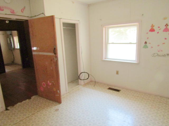 4816 Brush Creek Road Riner, VA 24149 - Photo 11 of 17 an empty room with windows and closet