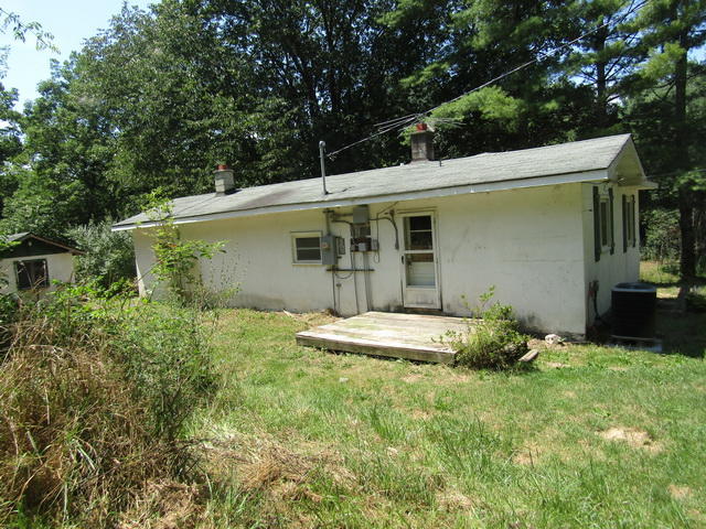 4816 Brush Creek Road Riner, VA 24149 - Photo 17 of 17 a backyard of a house with table and chairs