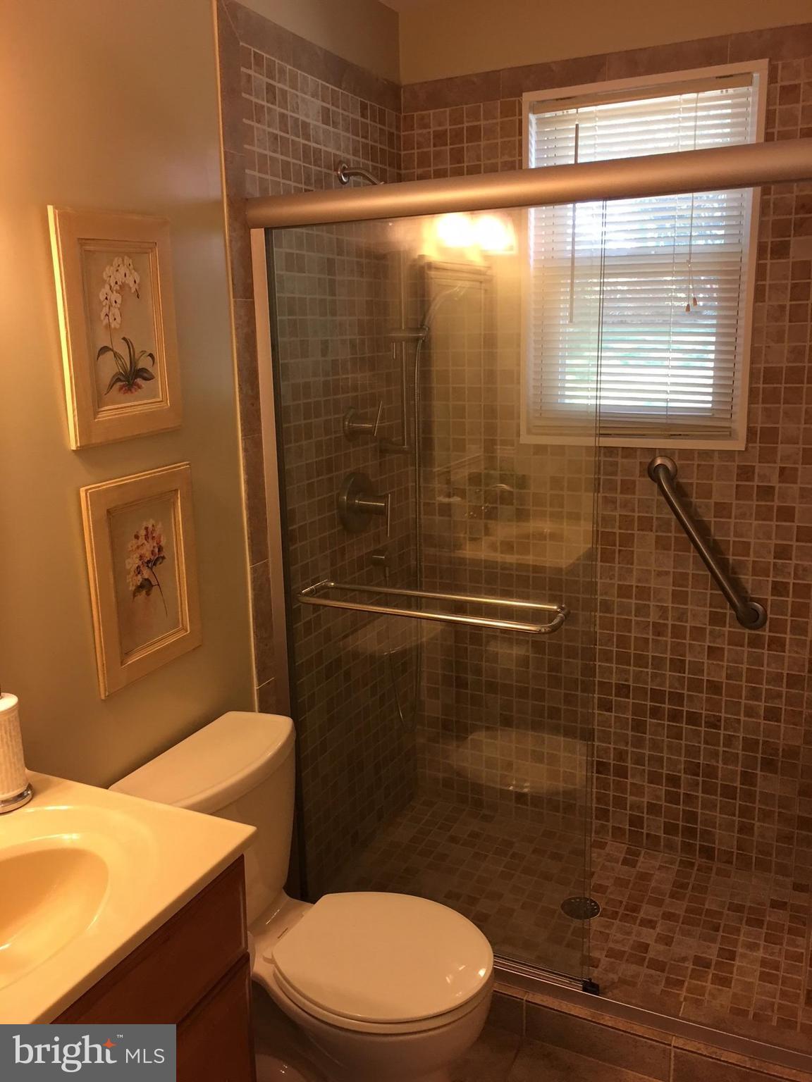 511 Mansfield Road Silver Spring, MD 20910 - Photo 11 of 29 a bathroom with a toilet a sink and shower
