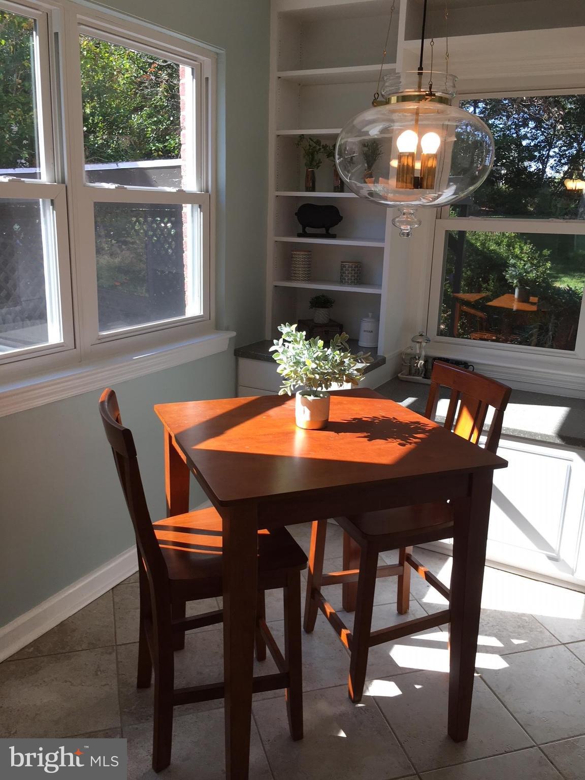 511 Mansfield Road Silver Spring, MD 20910 - Photo 13 of 29 a view of a dining room with furniture and window