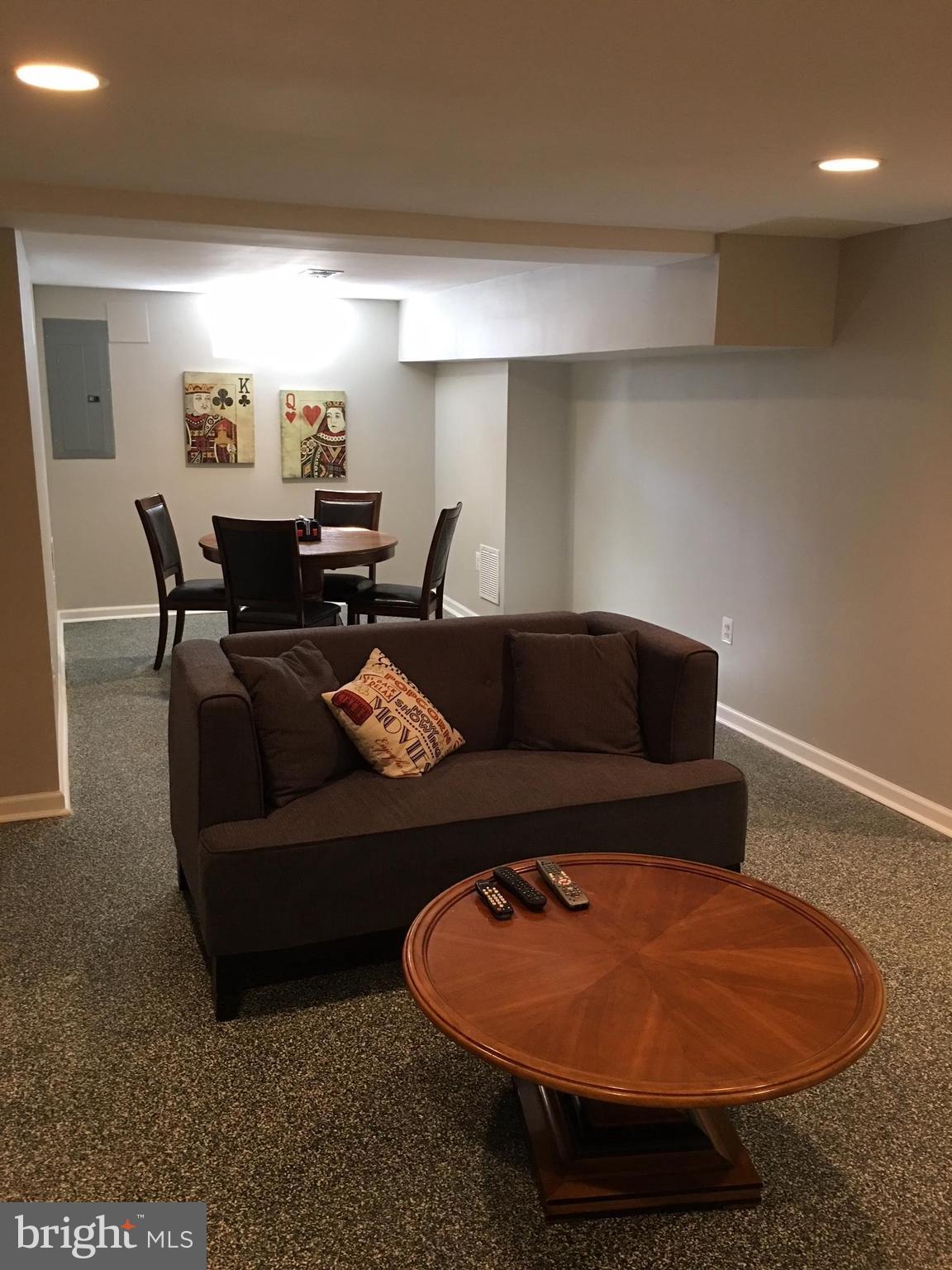 511 Mansfield Road Silver Spring, MD 20910 - Photo 22 of 29 a living room with furniture and a rug