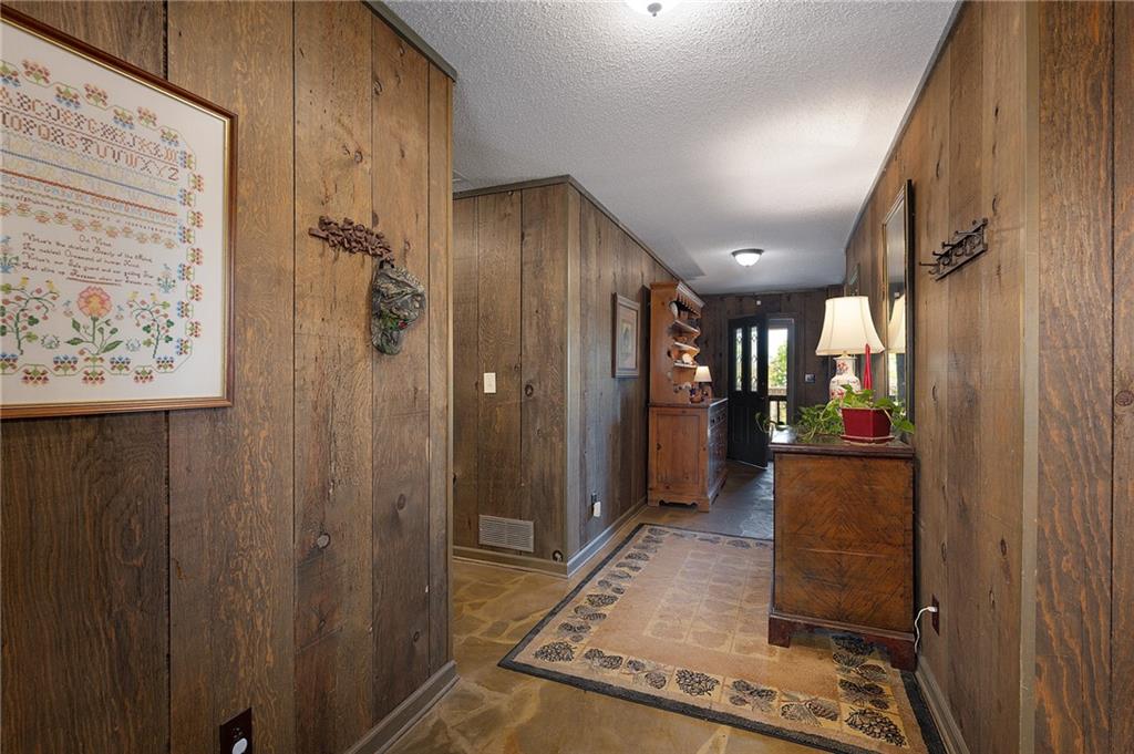 1339 Ridgeview Drive Big Canoe, GA 30143 - Photo 35 of 81 a view of a hallway with wooden shelves