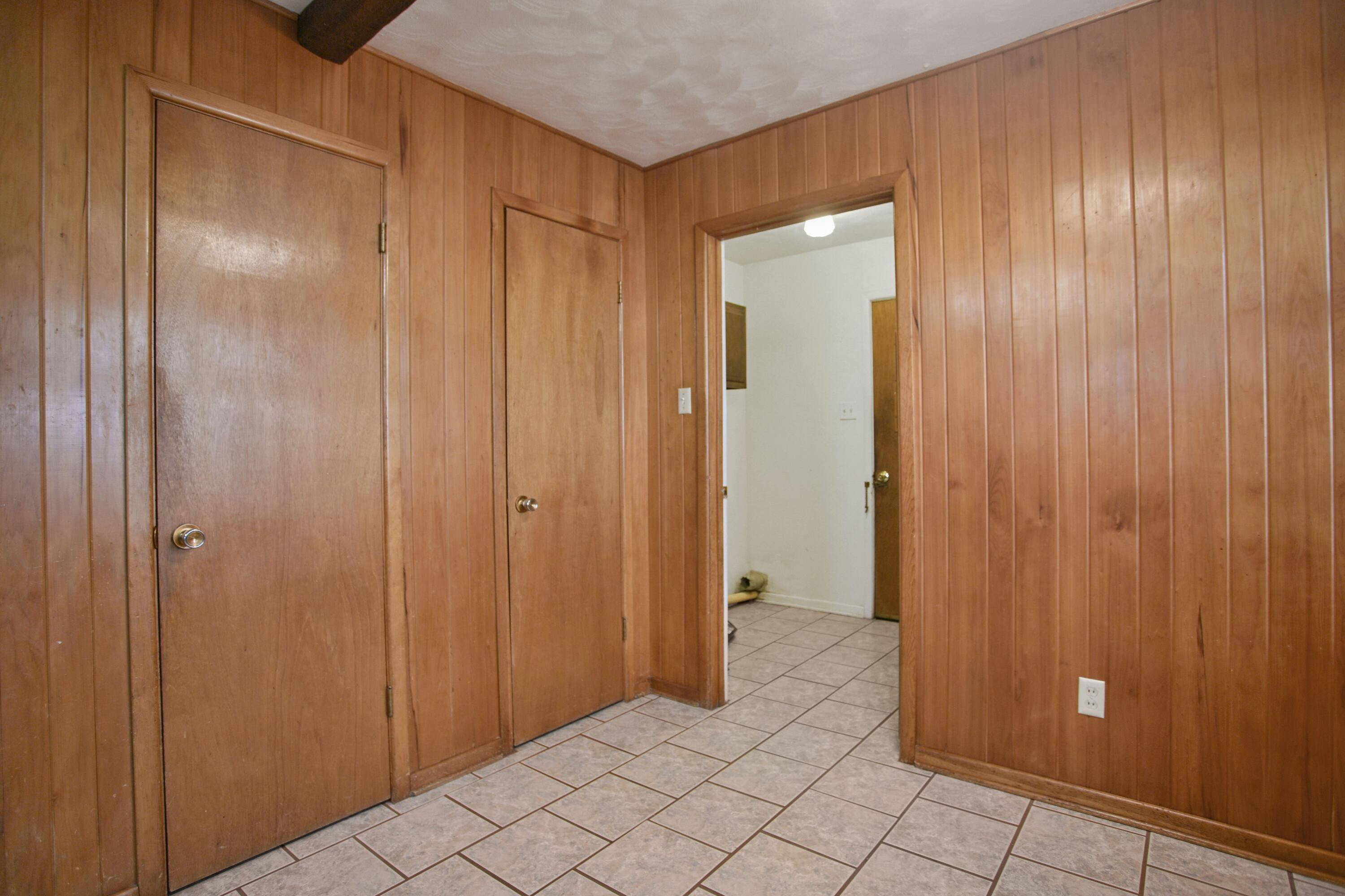 5420 8th Street Lubbock, TX 79416 - Photo 16 of 35 a view of an empty room with wooden door