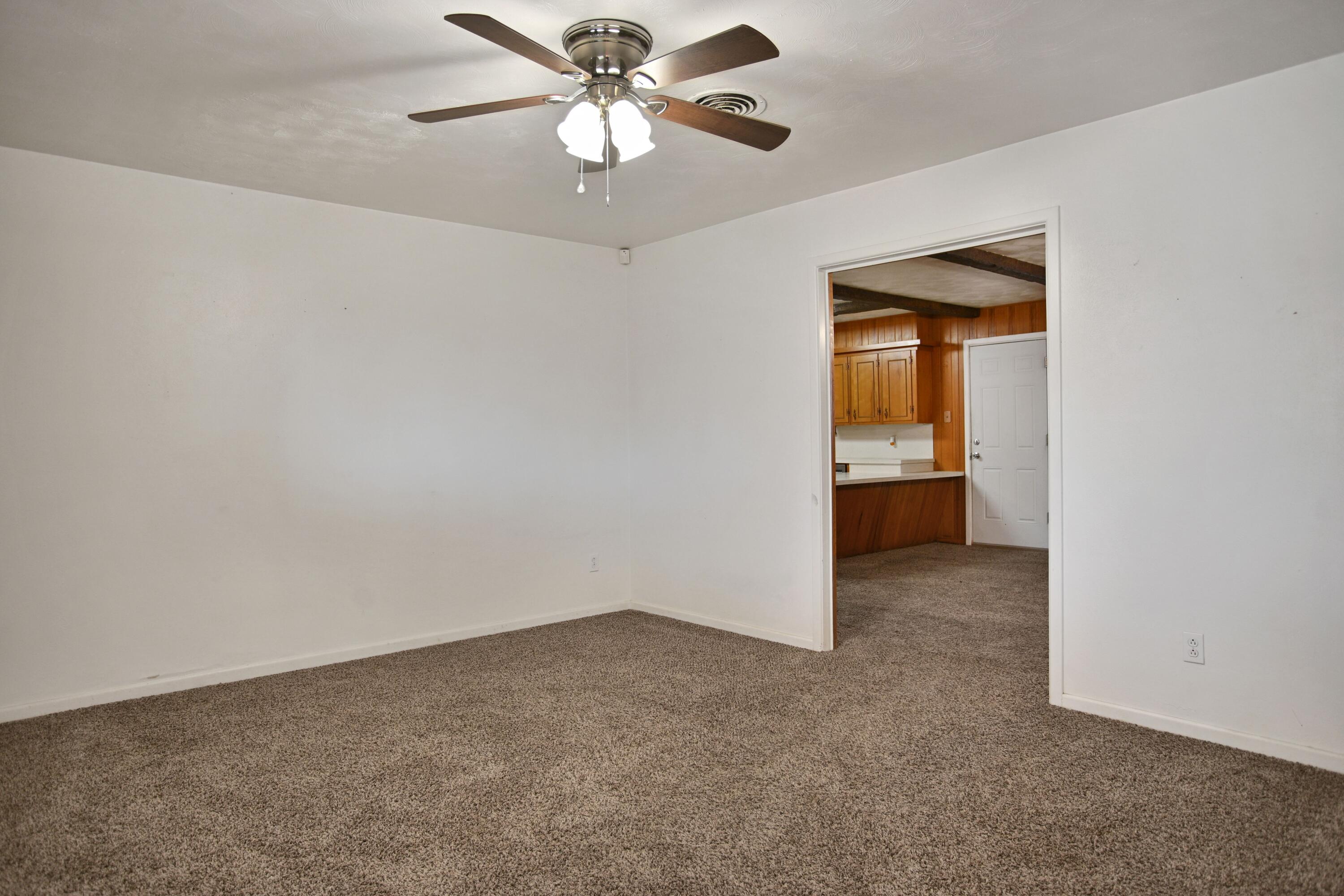 5420 8th Street Lubbock, TX 79416 - Photo 17 of 35 an empty room with a empty space and a ceiling fan
