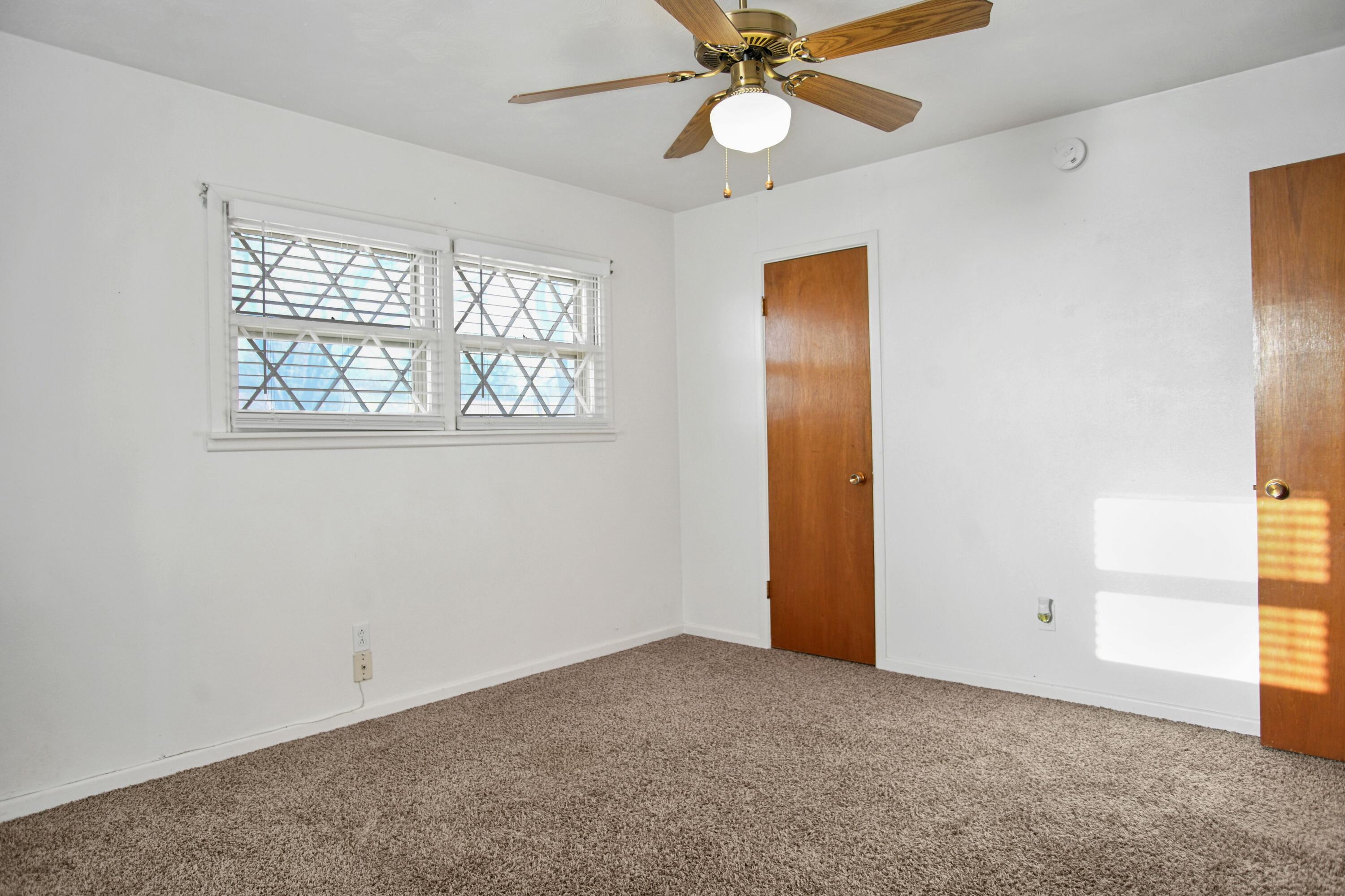 5420 8th Street Lubbock, TX 79416 - Photo 20 of 35 a view of an empty room with a window