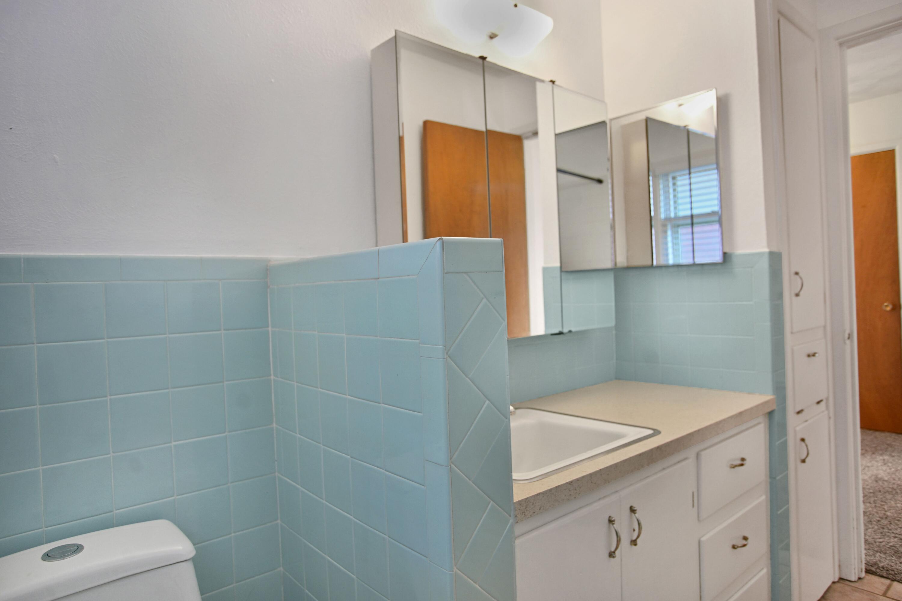 5420 8th Street Lubbock, TX 79416 - Photo 23 of 35 a bathroom with a sink and a shower