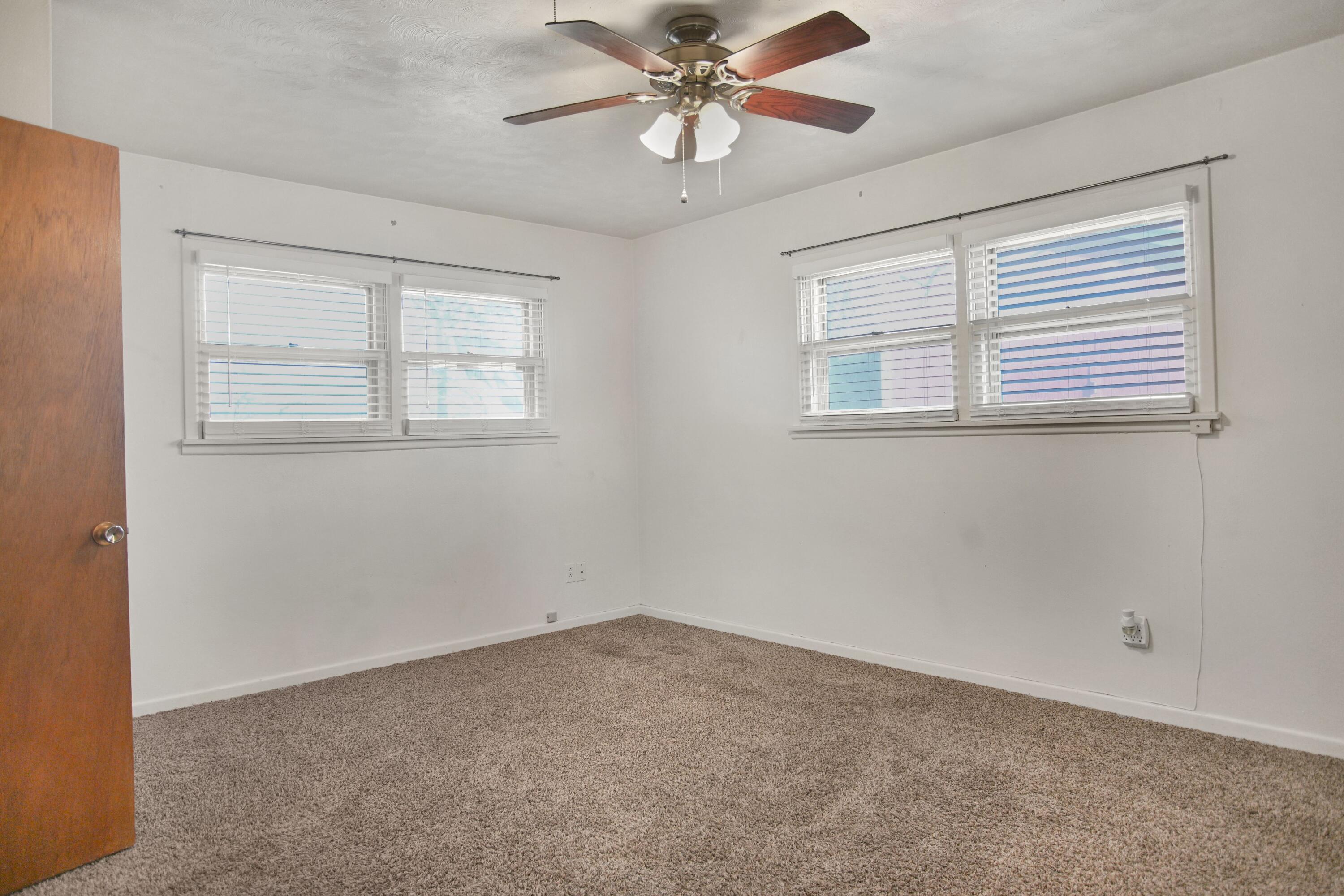 5420 8th Street Lubbock, TX 79416 - Photo 26 of 35 a view of an empty room with a window