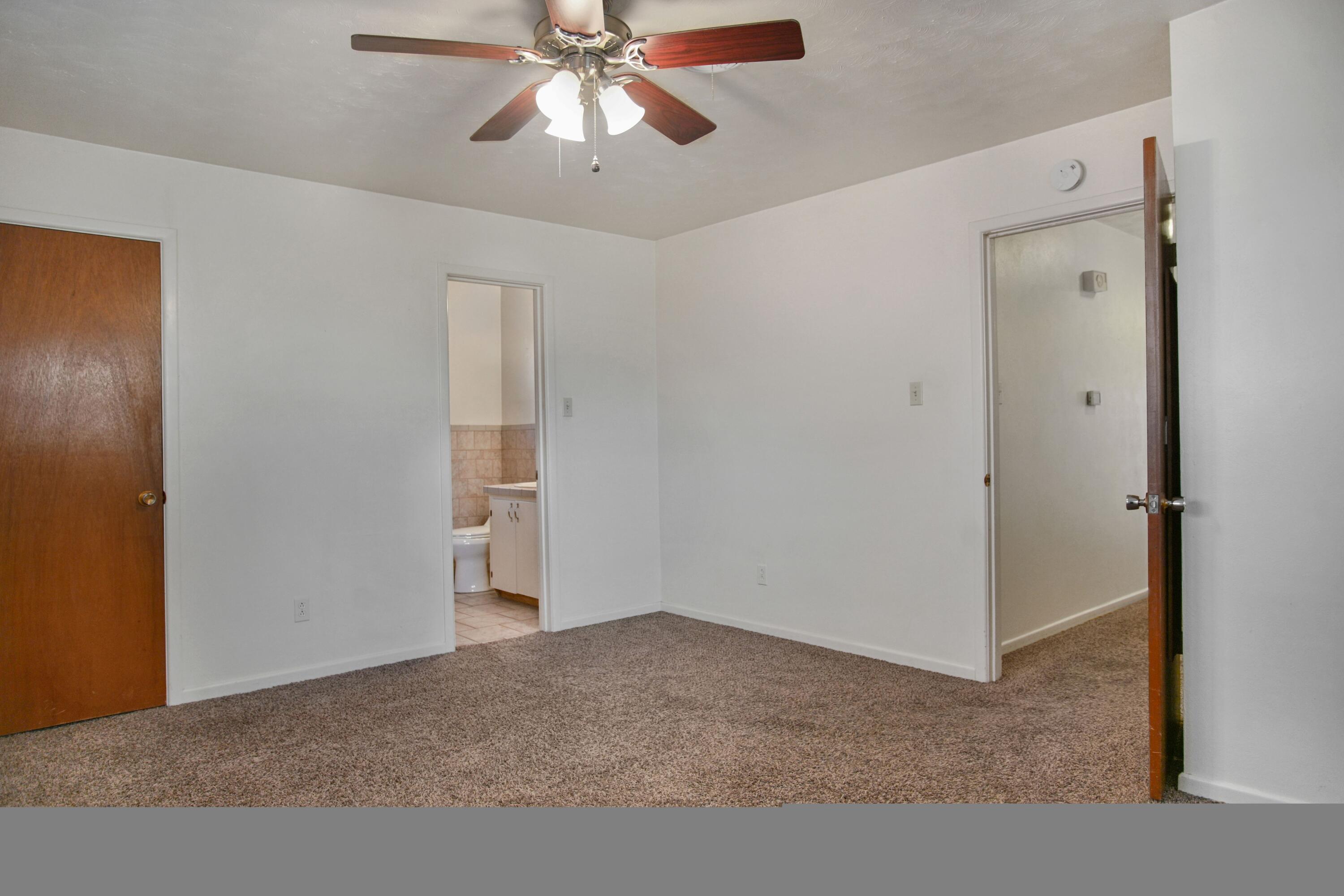 5420 8th Street Lubbock, TX 79416 - Photo 27 of 35 a view of an empty room with a fan