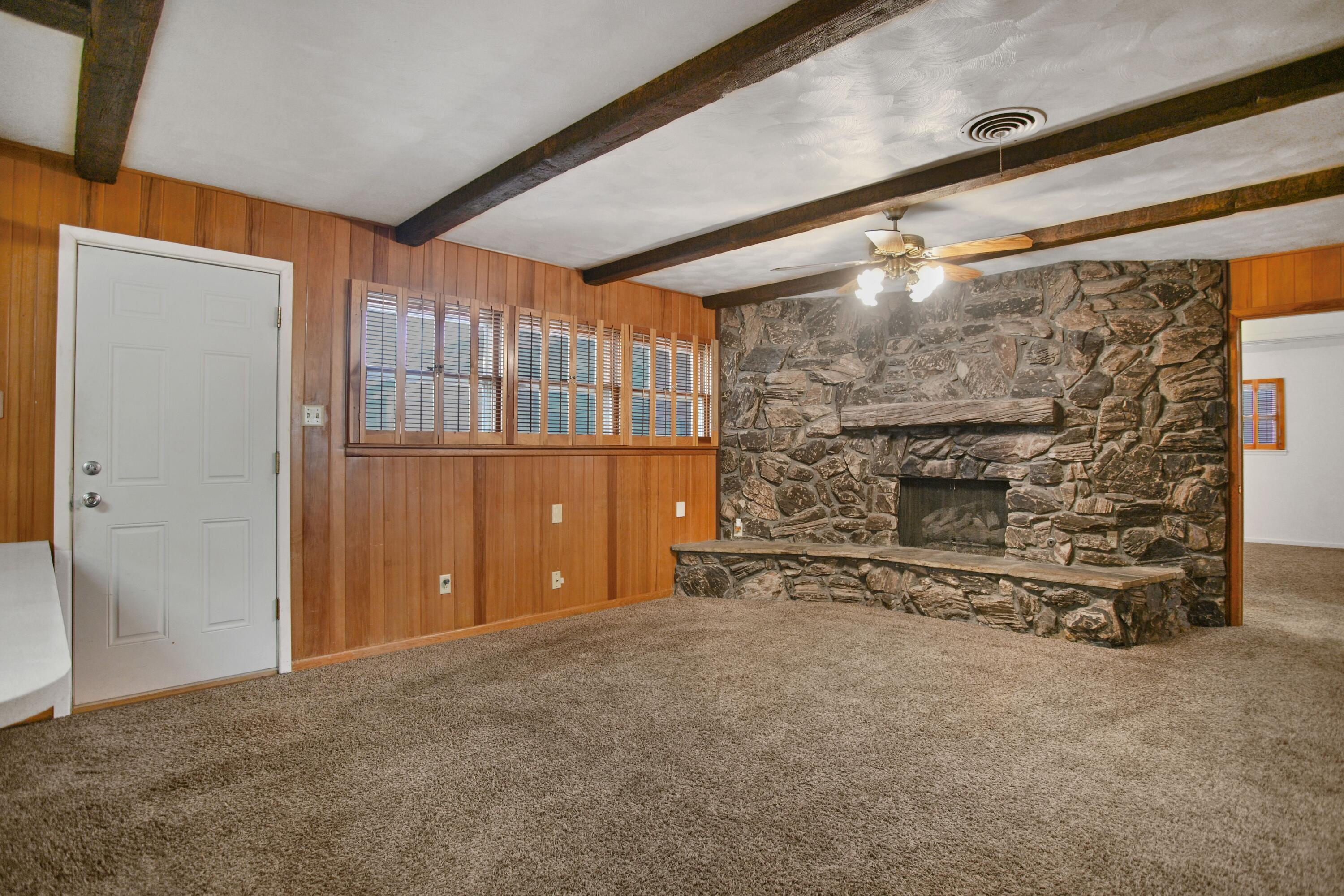 5420 8th Street Lubbock, TX 79416 - Photo 3 of 35 a view of an empty room with a fireplace
