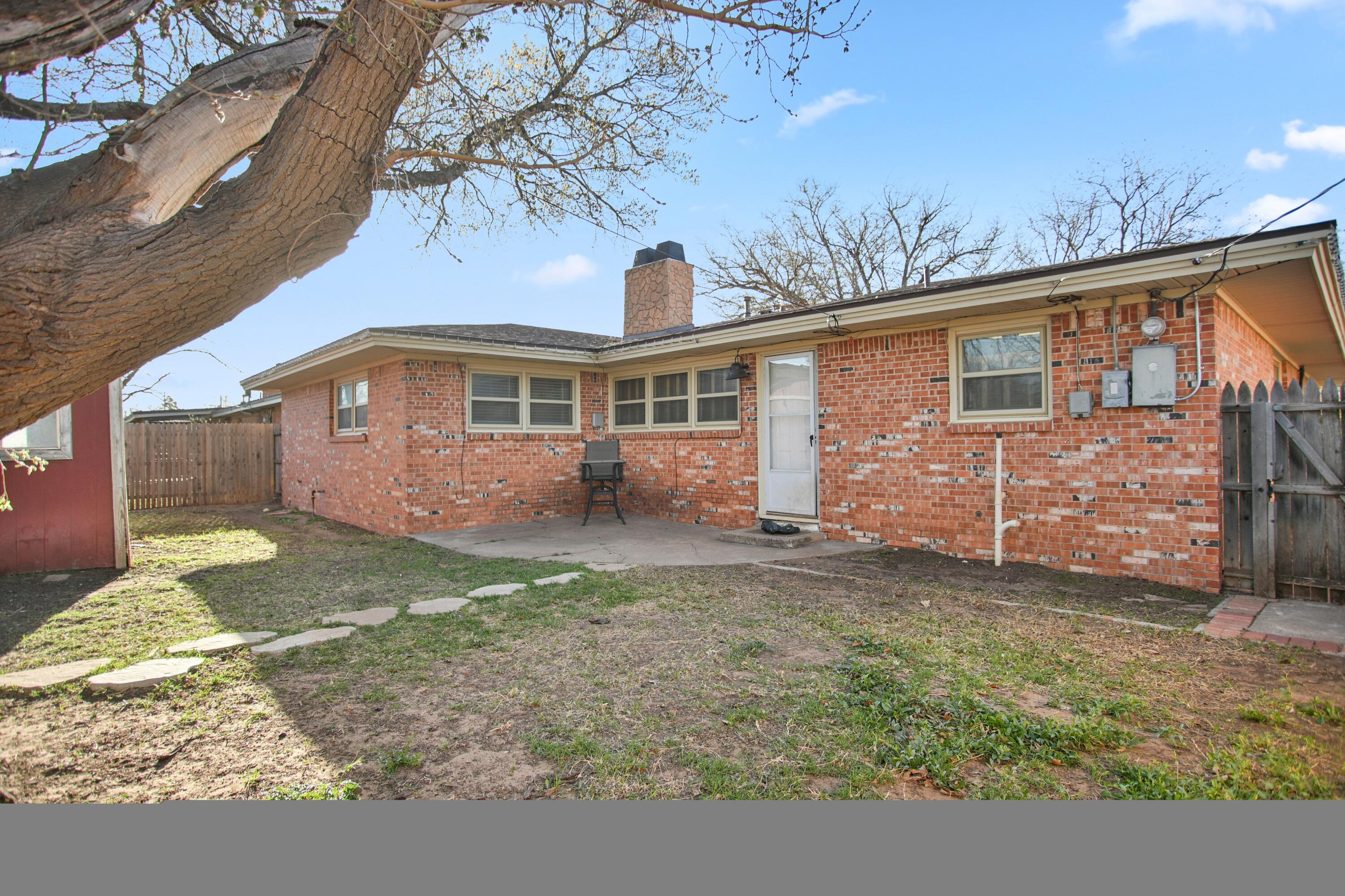 5420 8th Street Lubbock, TX 79416 - Photo 35 of 35 a view of a house with a yard