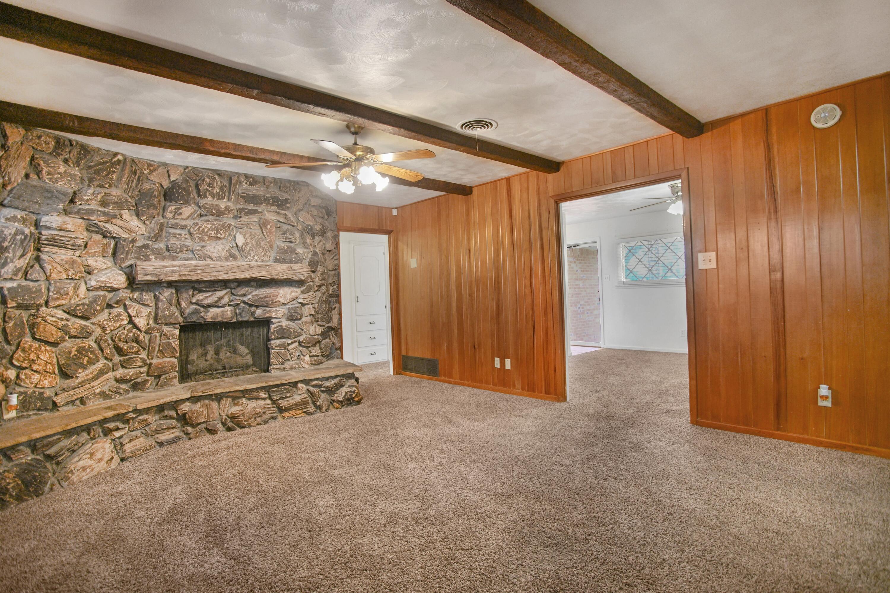 5420 8th Street Lubbock, TX 79416 - Photo 5 of 35 wooden floor and fireplace in an empty room