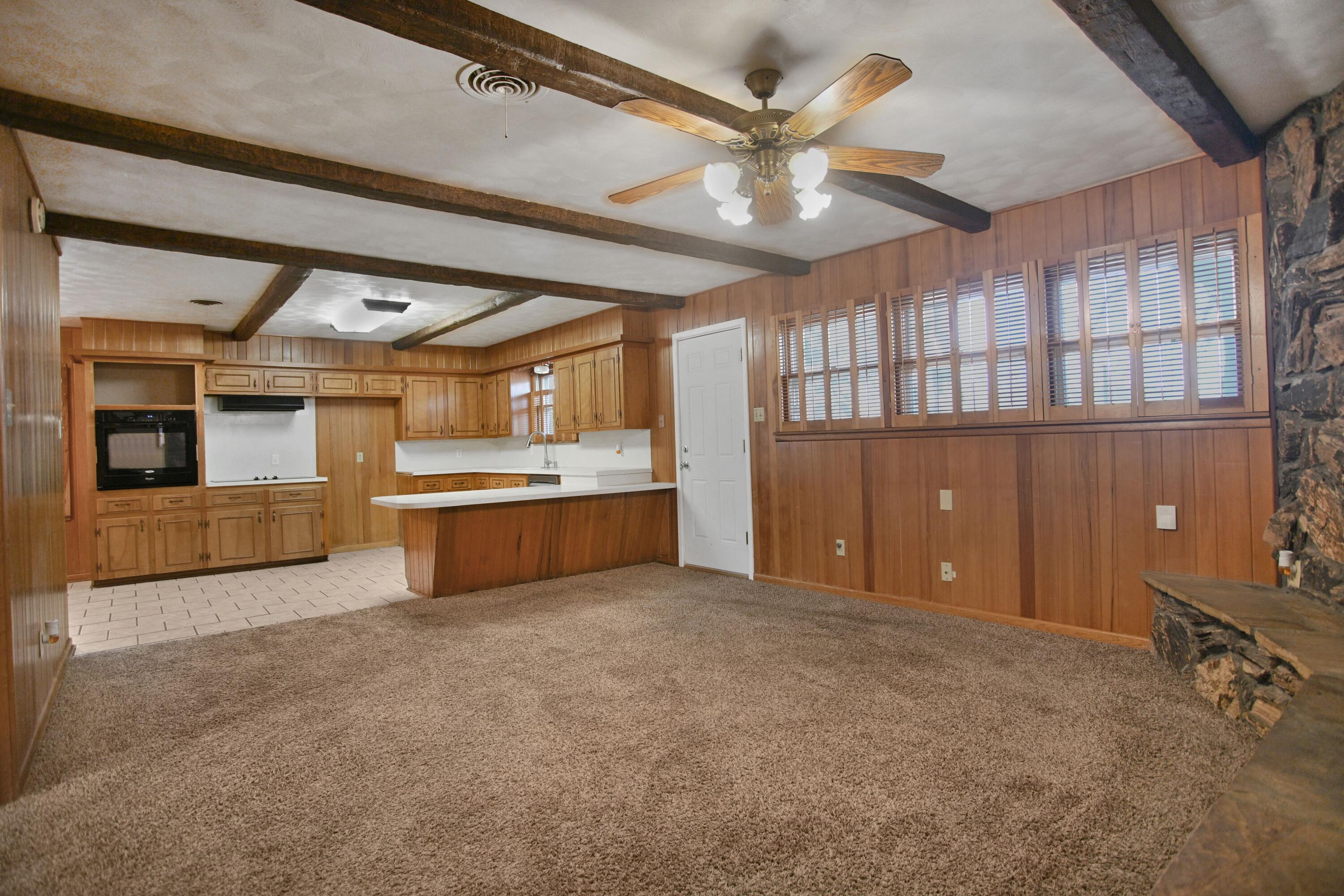 5420 8th Street Lubbock, TX 79416 - Photo 6 of 35 a large kitchen with cabinets and stainless steel appliances