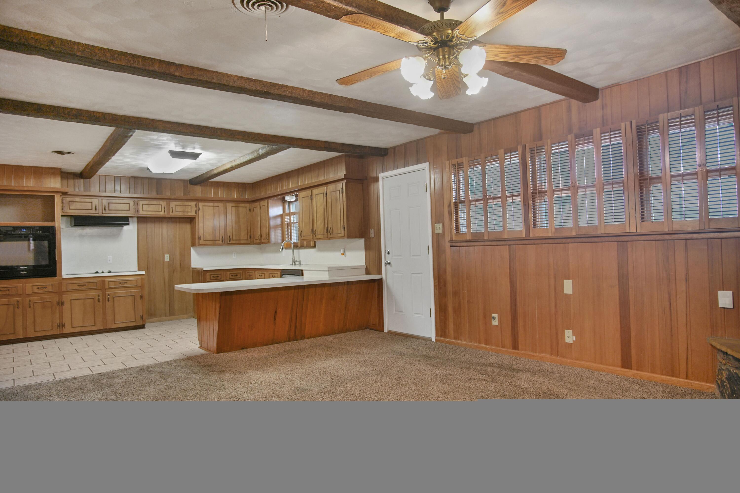 5420 8th Street Lubbock, TX 79416 - Photo 7 of 35 a large kitchen with stainless steel appliances kitchen island granite countertop a sink window and cabinets
