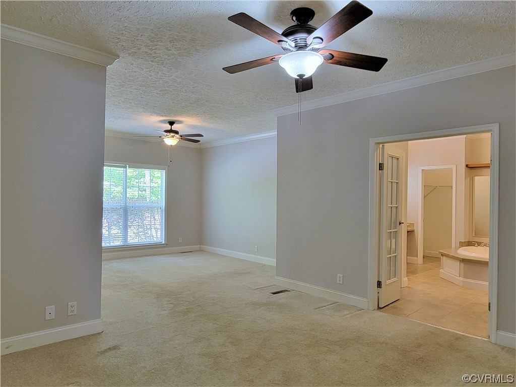 13569 Greenwood Road Glen Allen, VA 23059 - Photo 13 of 49 en empty room with windows and ceiling fan