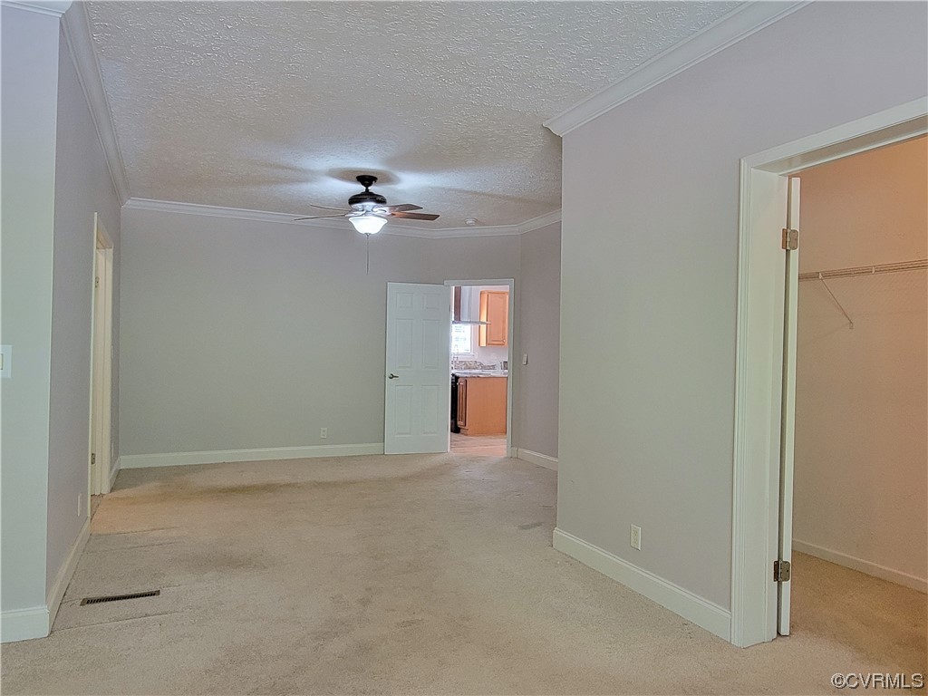13569 Greenwood Road Glen Allen, VA 23059 - Photo 16 of 49 an empty room with fan and entrance