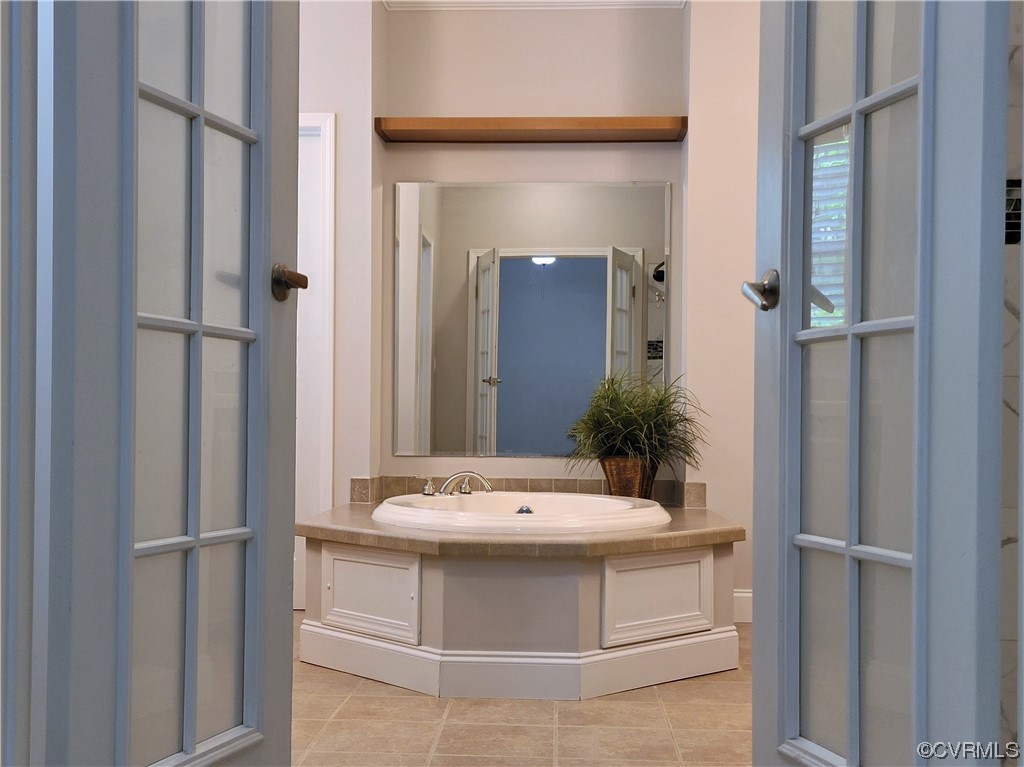 13569 Greenwood Road Glen Allen, VA 23059 - Photo 17 of 49 a bathroom with a sink and mirror