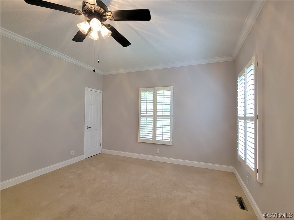 13569 Greenwood Road Glen Allen, VA 23059 - Photo 20 of 49 an empty room with windows and fan