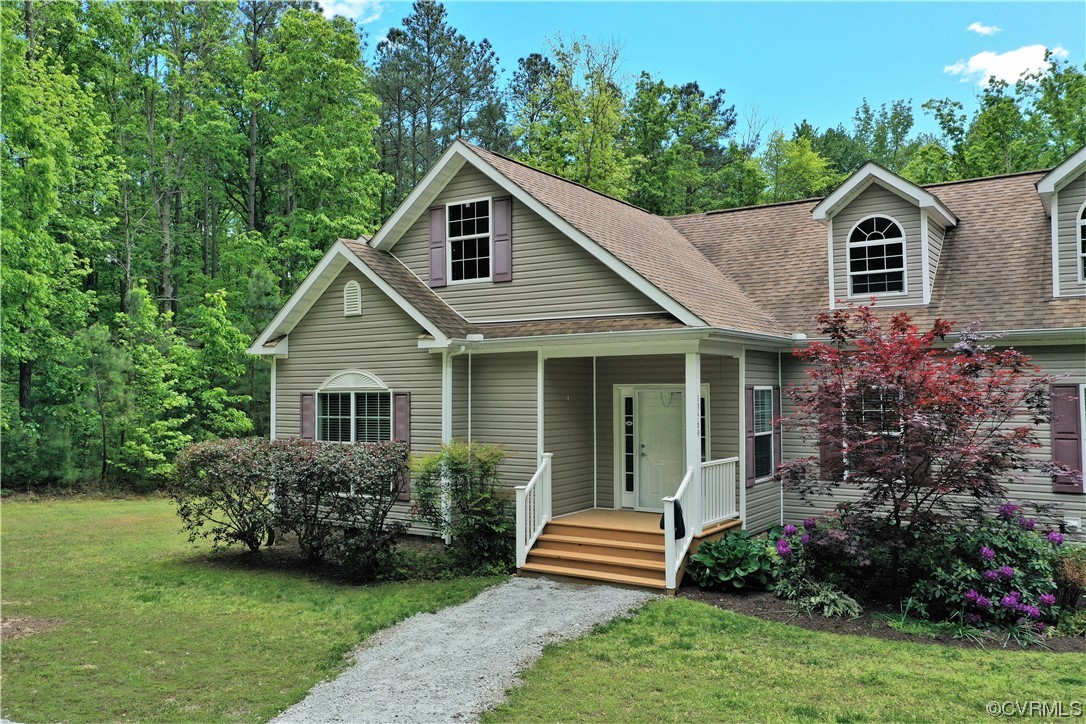 13569 Greenwood Road Glen Allen, VA 23059 - Photo 2 of 49 a view of a house with a yard and potted plants