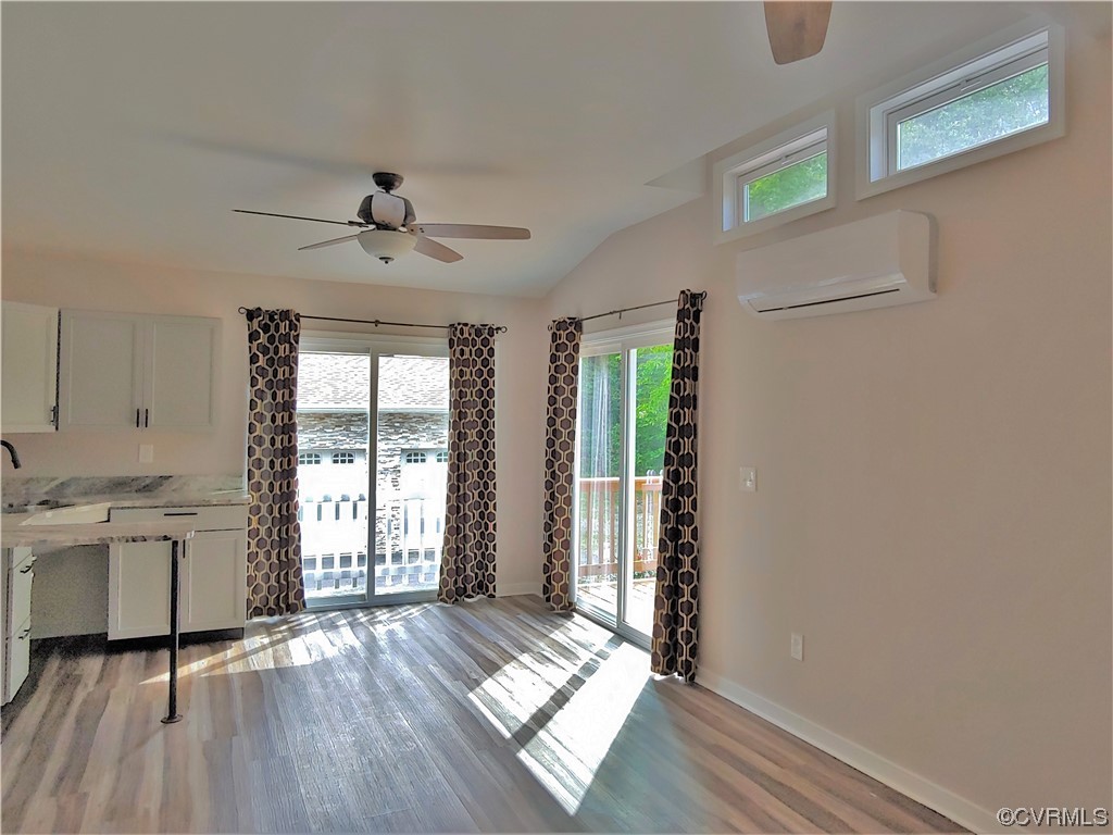 13569 Greenwood Road Glen Allen, VA 23059 - Photo 28 of 49 a view of an empty room with a window and wooden floor