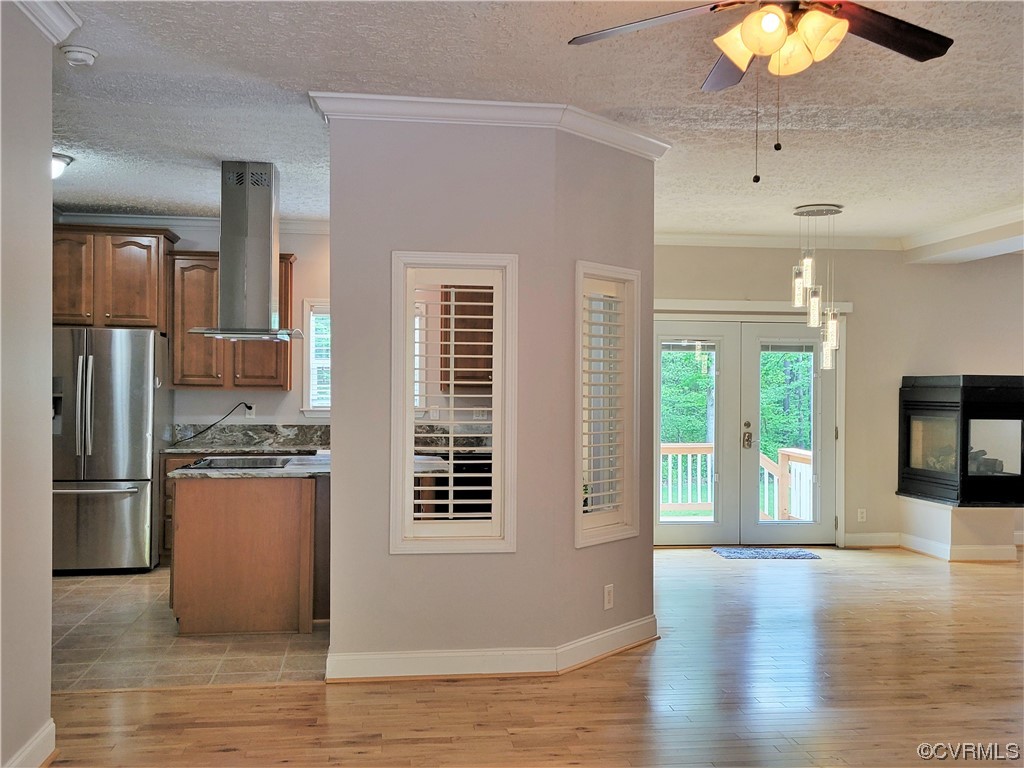 13569 Greenwood Road Glen Allen, VA 23059 - Photo 3 of 49 a view of a kitchen with a stove fridge and wooden floor