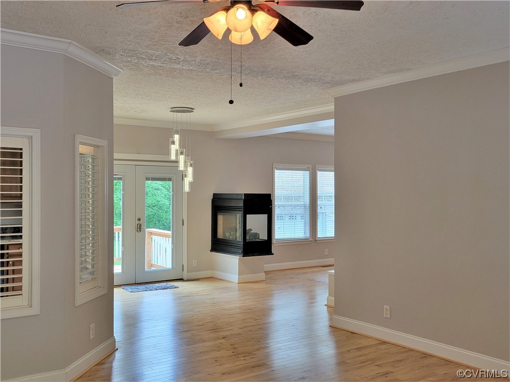 13569 Greenwood Road Glen Allen, VA 23059 - Photo 4 of 49 an empty room with wooden floor and windows